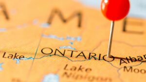 Close up of a map of Ontario with a single red pin dop