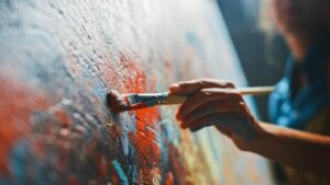 Close up of an unidentified artist painting an abstract oil painting