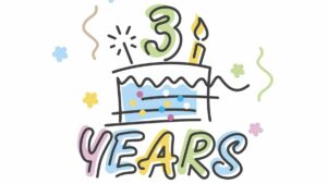 line drawing of a cake on a white background. Top of cake has sparkler, a number three, and a traditional birthday style candle. Years is written underneath cake. Pastel grren, blue, yellow, pink decorate cake, 3, years and candle
