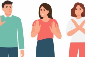 Digital illustration. One man and two women stand in a line facing the viewer. Each is miming a different 'no' or 'stop' action