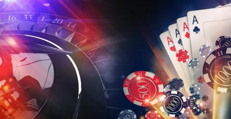 Gambling chips and cards on a green purple Casino table
