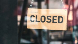 Gateway's 14 Ontario casinos close due to cyber attack. Closed sign hangs on door.