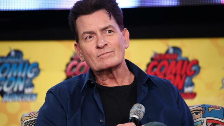 Charlie Sheen Added to cast of Chuck Lorre new comedy, How to Be a Bookie. Image, Sheen on stage at ComicCon Germany in 2019