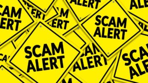 bc commission accuses crypto firm of millions in fraud. Haphazard pile of safety yellow scam alert signs