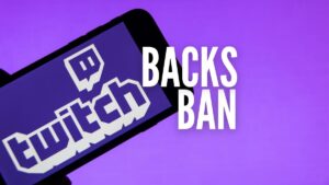 twitch ceo dan clancy backs unregulated gambling ban in twitchtv interview. Image of twitch logo on smartphone on purple background with text backs ban in white