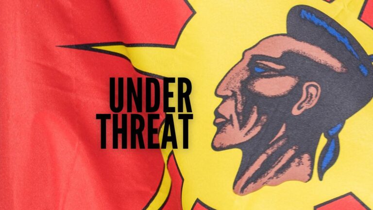 kahnawake gambling threatened by proposed gambling bill, S-268. Image mohawk warrier flag background. Text: under threat