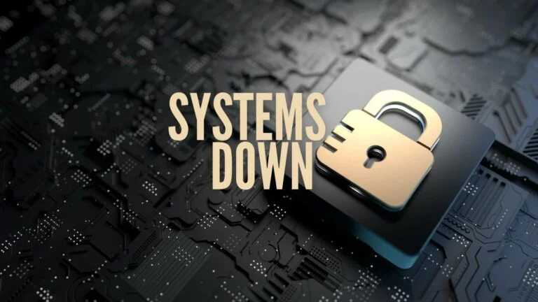 mgm properties suffer widespread us outage. gold padlock gold text: systems down on black circuit board background.