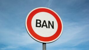 michigan picks dfs ban takes effect. circle sign reading ban seen against blue sky