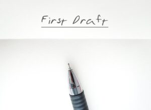 A Piece of Paper Bears the Words "First Draft"