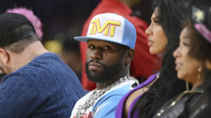 Boxer Floyd Mayweather Jr., shown here after retirement attending an NBA basketball game, has signed a partnership deal with Games Global for the development of a slot game featuring his likeness.