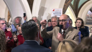 Republican Missouri state Sen. Denny Hoskins, a member of the Freedom Caucus, speaks to hundreds of supporters gathered Tuesday, Jan. 30, 2024, at the Missouri Capitol in Jefferson City, Mo.