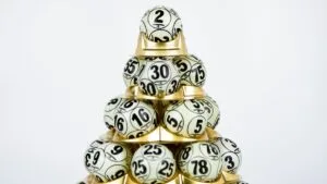 lottery balls stacked on golden holder