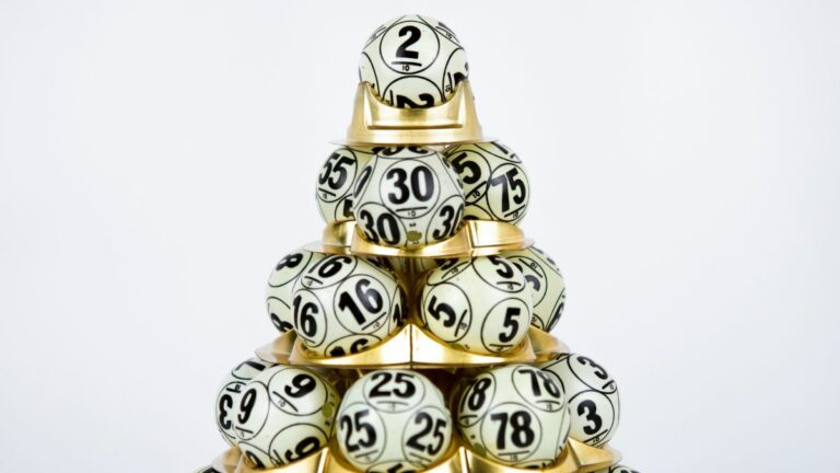 lottery balls stacked on golden holder