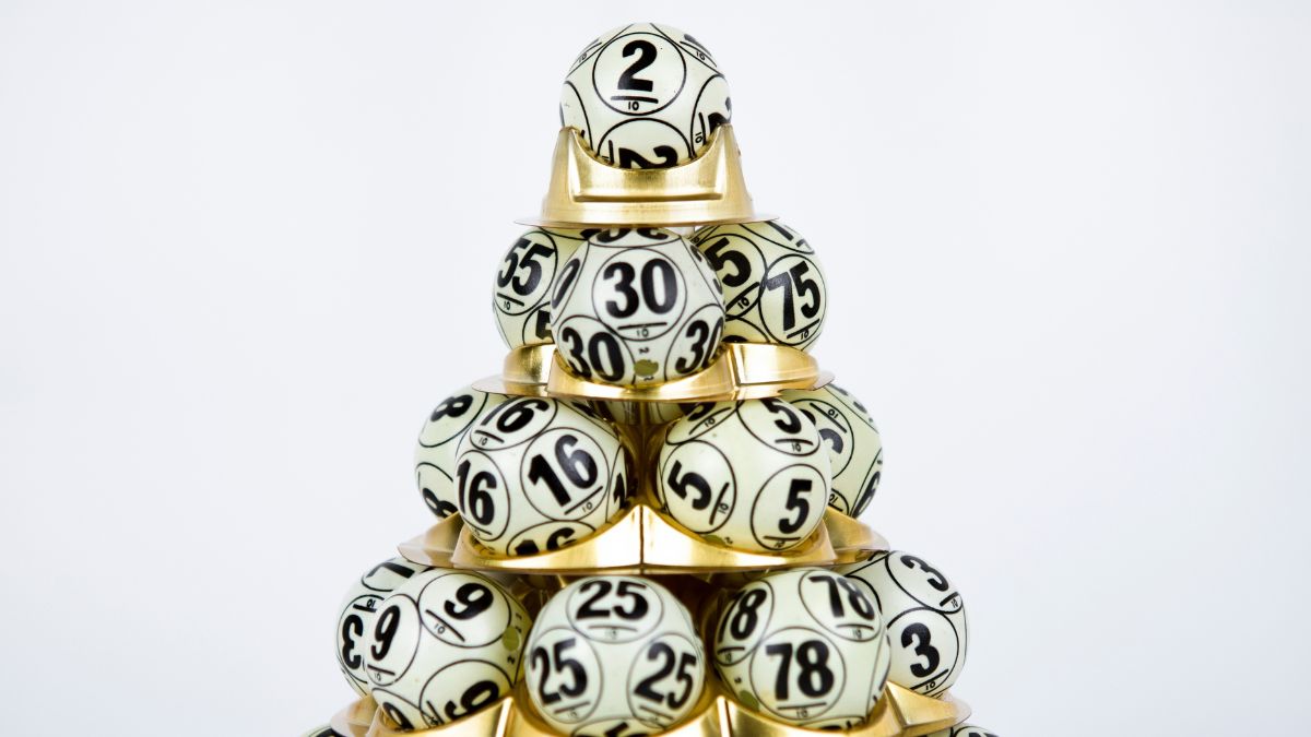 lottery balls stacked on golden holder