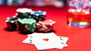 a blackjack hand in front of a stack of chips