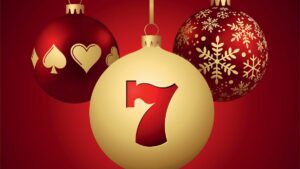 three christmas ornaments with gambling icons on them