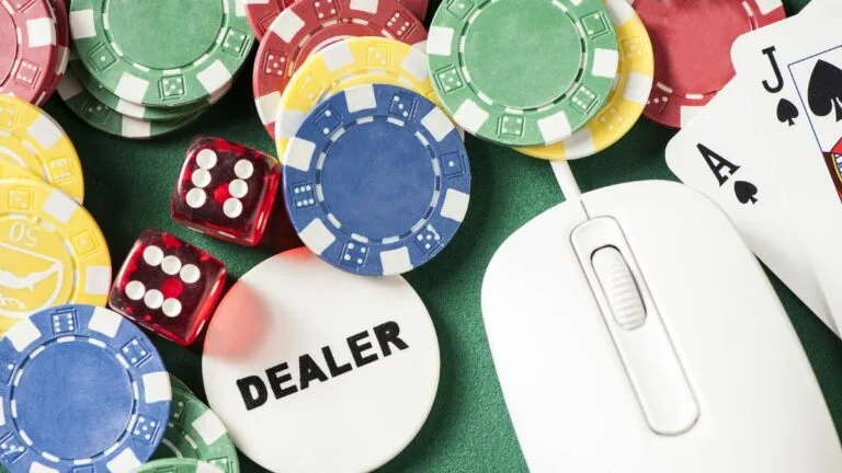 a collection of poker chips, dice and a mouse