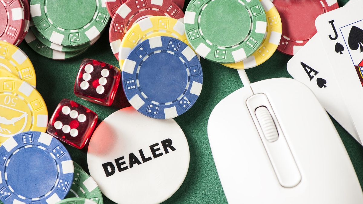 a collection of poker chips, dice and a mouse
