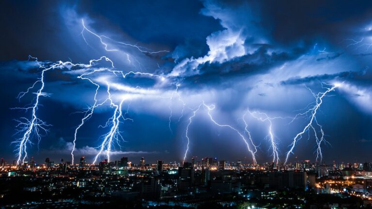 a series of lightning bolts over a city