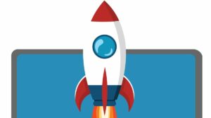white rocket with red nose, navy base and round blue window takes off with laptop screen in background