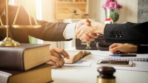 two people shaking hands at a legal office