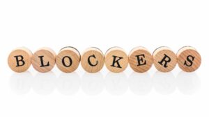 a set of wooden tiles spelling out blockers