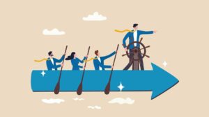 a group of business people on an arrow shaped boat moving forward