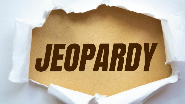 the word jeopardy appearing through a torn white background