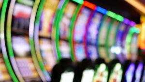 a blurred image of a series of slot machines