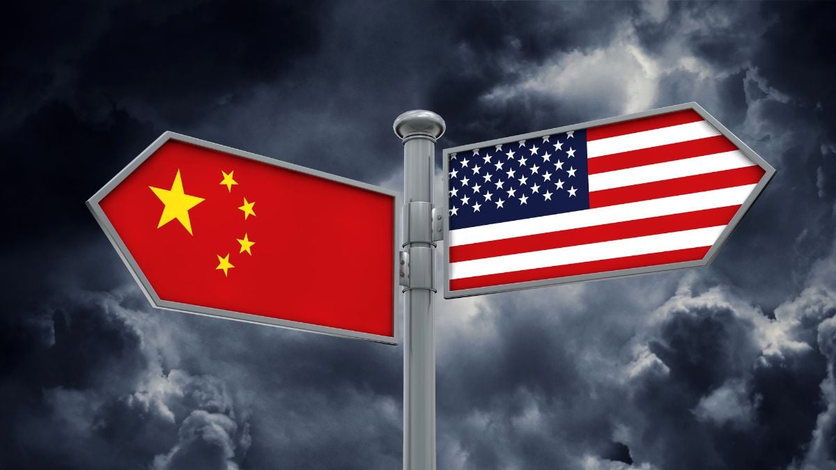 a china and us flag street marker pointing in opposite directions