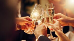 a series of champagne glasses coming together in celebration