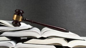 a gave sitting atop a stack of legal books