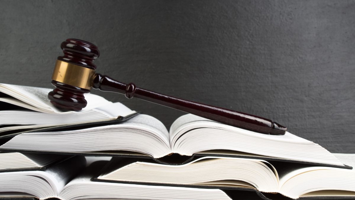 a gave sitting atop a stack of legal books