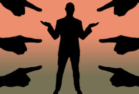 Accusations pointing fingers business man silhouette