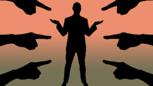 Accusations pointing fingers business man silhouette