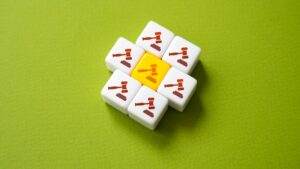 a series of tiles with gavels on them including a yellow one in the middle