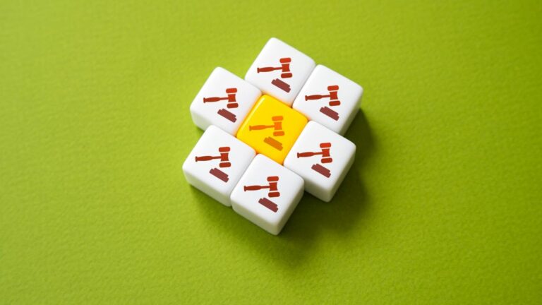 a series of tiles with gavels on them including a yellow one in the middle