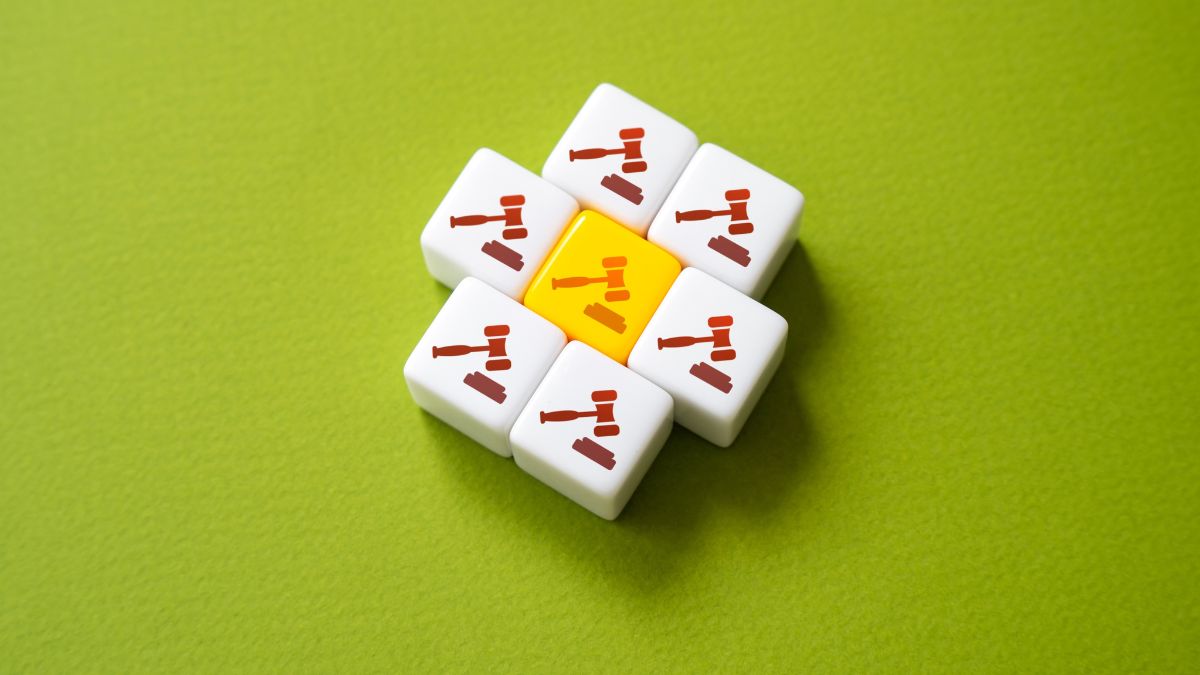 a series of tiles with gavels on them including a yellow one in the middle