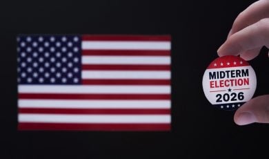 2026 American Midterm Elections sign in front of US flag