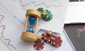 Blue poker chips on stock market chart background