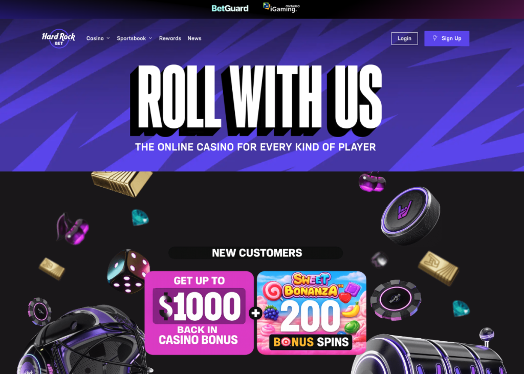 Screenshot of the Hard Rock Bet Ontario online casino homepage featuring a purple-themed promotional banner with the headline “ROLL WITH US” and the tagline “The Online Casino for Every Kind of Player.” The page includes navigation links for Casino, Sportsbook, Rewards, and News, along with Login and Sign Up buttons. A new customer offer promotes up to $1,000 back in casino bonus funds plus 200 Sweet Bonanza bonus spins. Casino-themed graphics including poker chips, dice, slot machine imagery, gold bars, gems, and cherries surround the promotion. The image showcases the Hard Rock Bet Ontario online casino landing page and welcome bonus offer for new players. Provide your feedback on BizChat