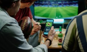 Legal sports betting on team in app on smartphone