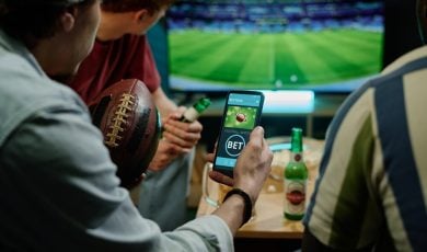 Legal sports betting on team in app on smartphone