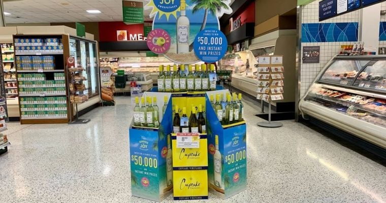 Cupcake vineyards displaying and promoting summer of joy sauvignon blanc wine with a sweepstakes in Publix supermarket