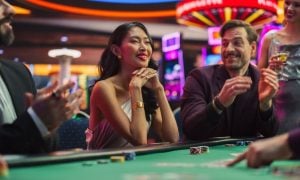 Diverse Group of People Playing in a Poker Game