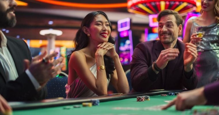 Diverse Group of People Playing in a Poker Game
