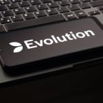 Evolution Gaming Group logo displayed on a smartphone screen