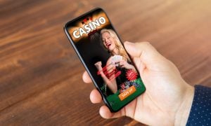 Man viewing online casino ad on his mobile phone