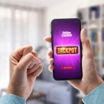 User winning jackpot on online casino app, online games and gambling concept
