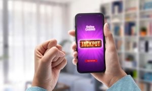 User winning jackpot on online casino app, online games and gambling concept